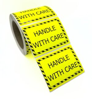 100×75 HANDLE WITH CARE Fluro Yellow Warning Label Roll Black Printed W10075YHW